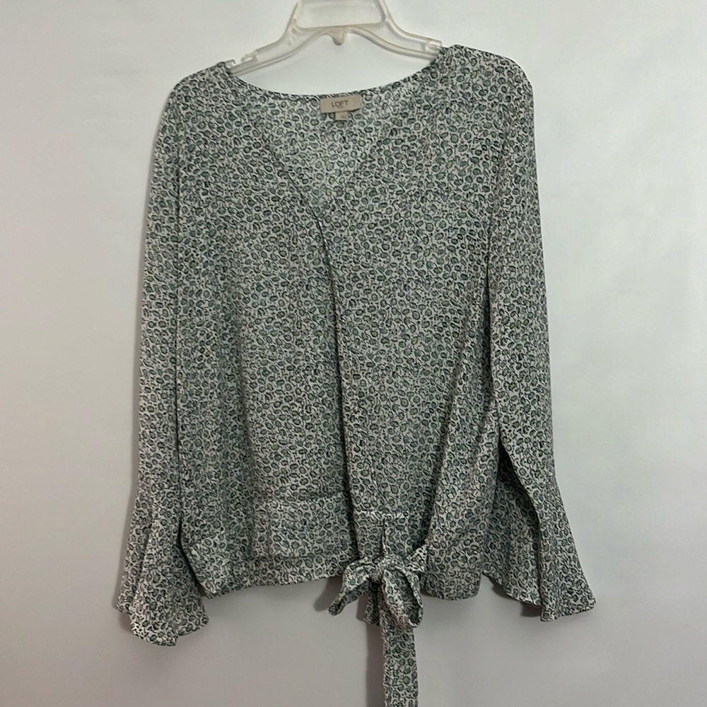 Blouse from Loft. White background with blue yellow and green flowers